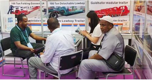 Nigerian Customers Visit TITAN's Booth at the Canton Fair to Buy Folding Gooseneck Trailer