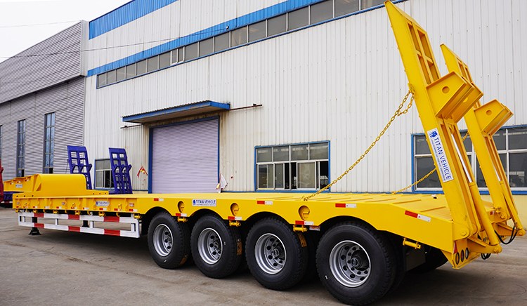 100 Ton 4 Axle Semi Low Bed Trailer for Sale with Hydraulic Ramp